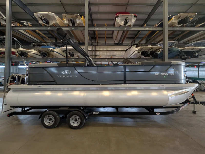 Slide: The Image of 2021 Veranda pontoon boat in warehouse on trailer. - 3