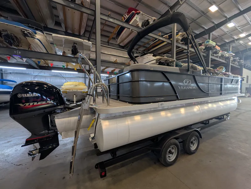 Slide: The Image of 2021 Veranda pontoon boat in warehouse with Yamaha engine. - 4