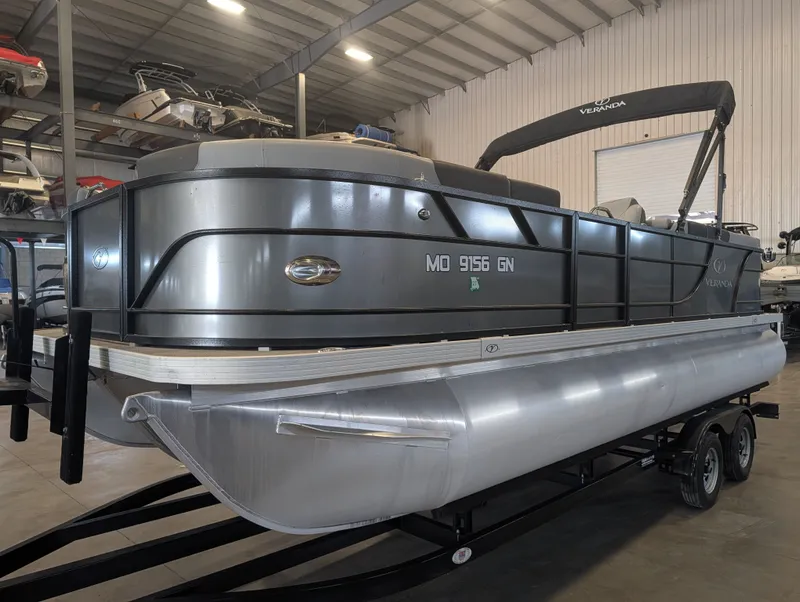 Slide: The Image of 2021 Veranda pontoon boat in warehouse on trailer. - 6