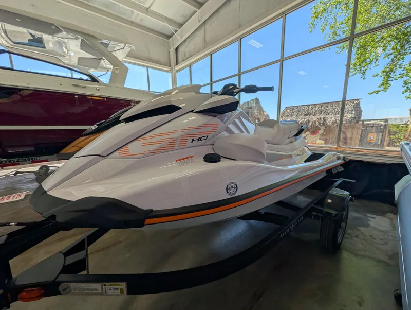 Slide: The Image of 2026 Yamaha GP1900A-CA jet ski in a showroom. - 2