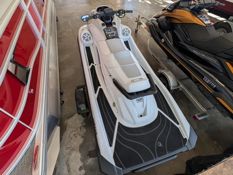 Slide: The Image of 2026 Yamaha GP1900A-CA jet ski parked in a garage. - 3