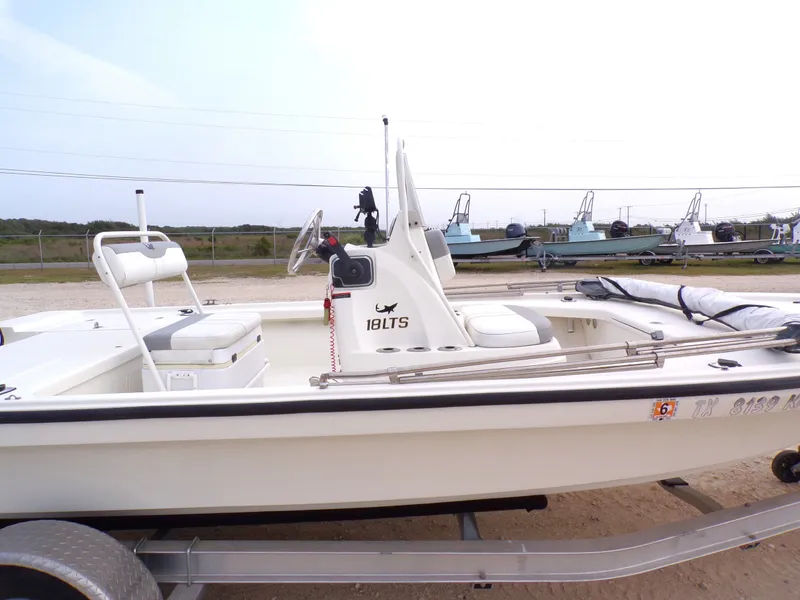 Slide: The Image of 2022 Mako 18 LTS boat on trailer, side view. - 34