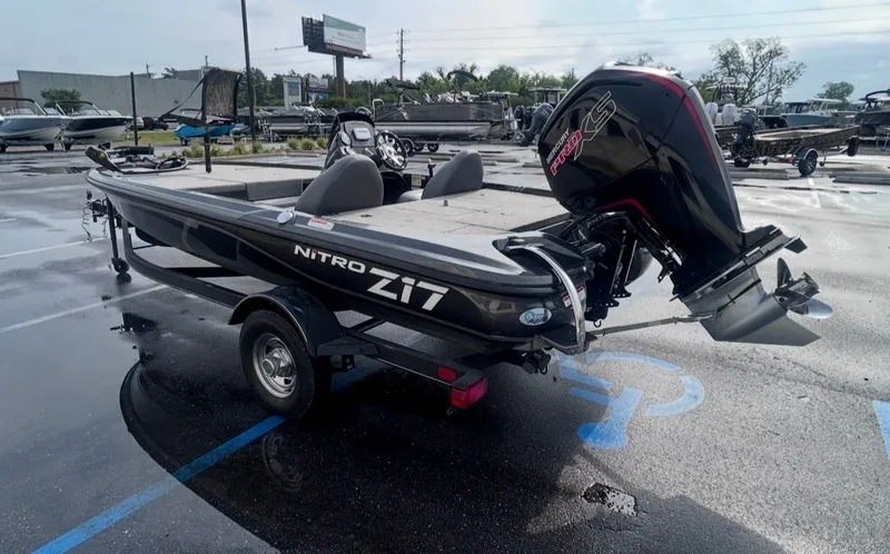 Slide: The Image of 2022 Nitro Z17 boat with outboard motor in parking lot. - 7