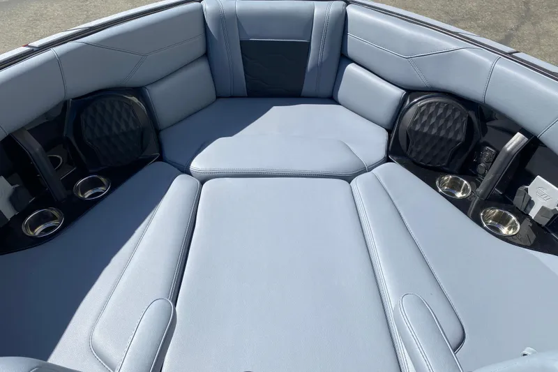 Slide: The Image of 2025 Malibu Wakesetter 23 LSV interior with luxurious seating and cup holders. - 11