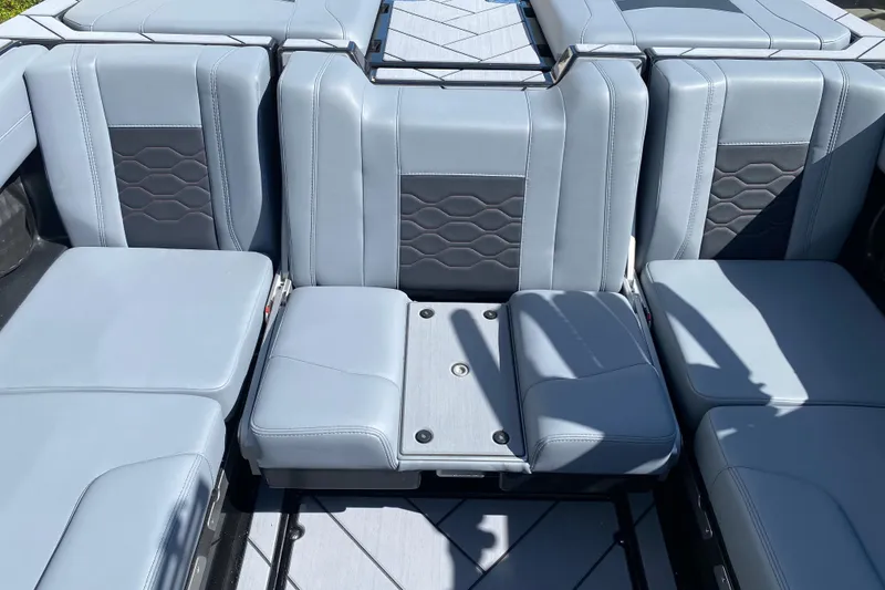 Slide: The Image of 2025 Malibu Wakesetter 23 LSV interior with sleek gray seating and modern design. - 12