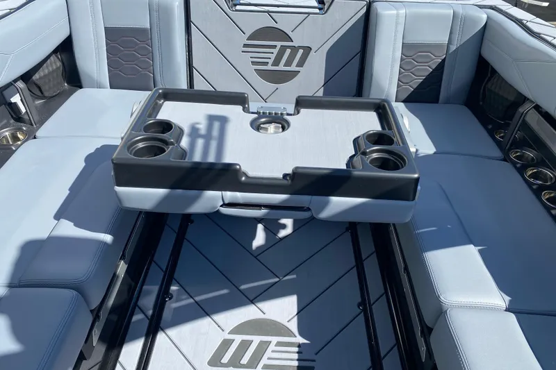 Slide: The Image of Interior of 2025 Malibu Wakesetter 23 LSV with seating and cup holders. - 14