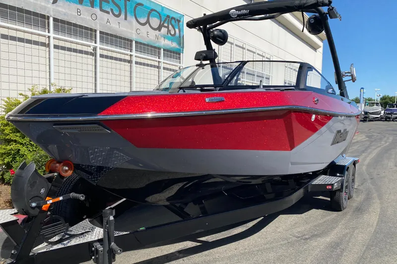 Slide: The Image of 2025 Malibu Wakesetter 23 LSV boat in vibrant red and gray, displayed at West Coast Boat Center. - 3