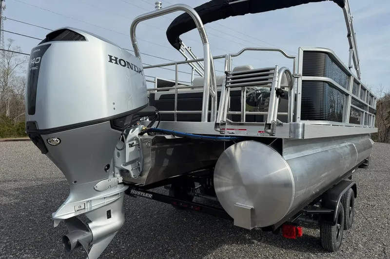 Slide: The Image of 2026 Montego Bay 140HP pontoon boat with Honda outboard motor on trailer. - 10