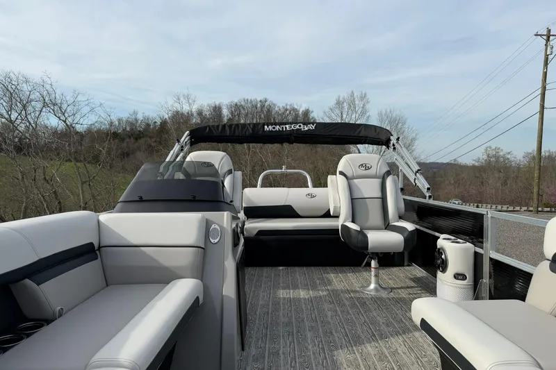 Slide: The Image of 2026 Montego Bay 140HP pontoon boat interior with modern seating and sleek design. - 11