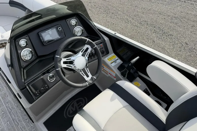 Slide: The Image of 2026 Montego Bay 140HP boat dashboard with steering wheel and control panel. - 15