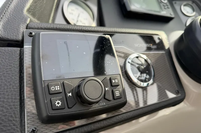 Slide: The Image of Dashboard of 2026 Montego Bay 140HP boat with control panel and gauges. - 17
