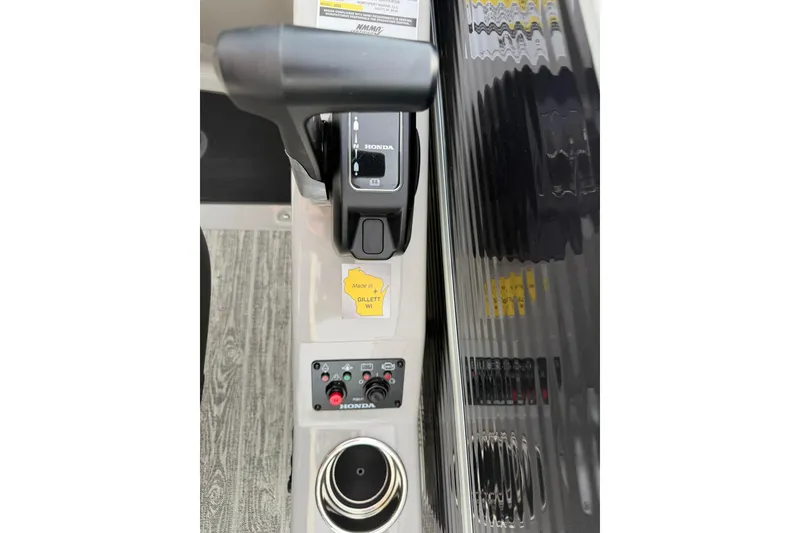 Slide: The Image of Control panel of 2026 Montego Bay 140HP boat with Honda throttle and switches. - 20