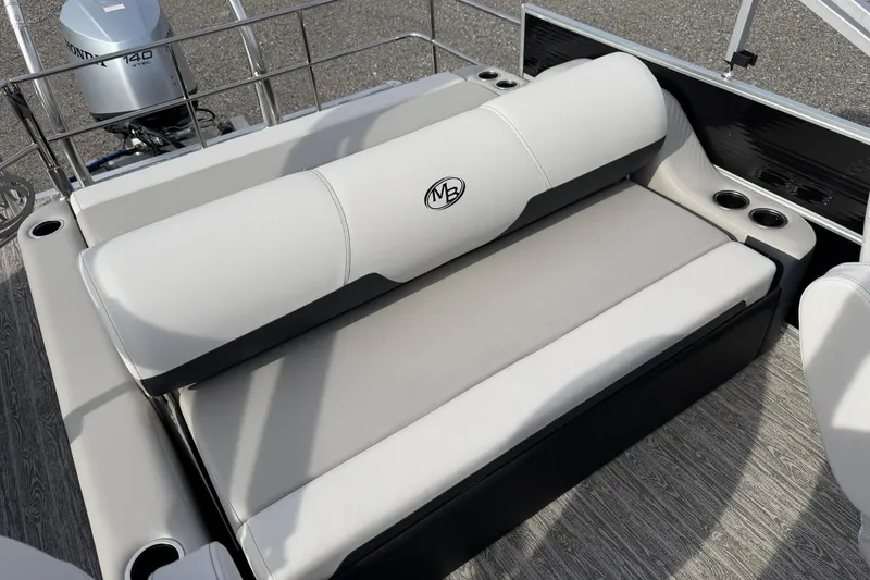 Slide: The Image of 2026 Montego Bay 140HP boat interior with cushioned seating and cup holders. - 22