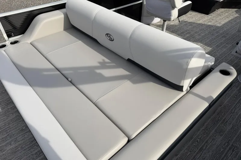 Slide: The Image of 2026 Montego Bay 140HP boat interior with sleek, modern seating and cup holders. - 23