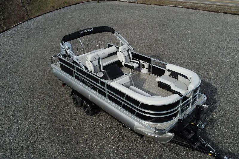 Slide: The Image of 2026 Montego Bay 140HP pontoon boat on trailer, featuring spacious seating and sleek design. - 4