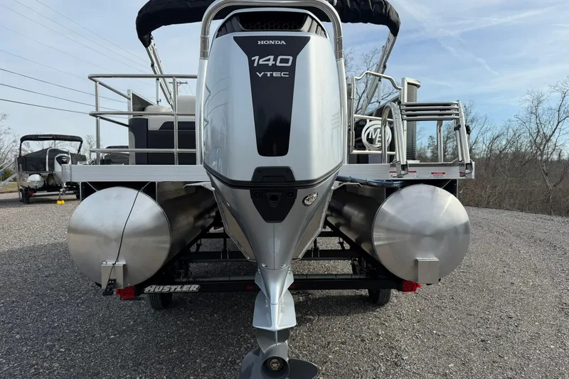 Slide: The Image of 2026 Montego Bay 140HP pontoon boat with Honda VTEC engine on gravel. - 9
