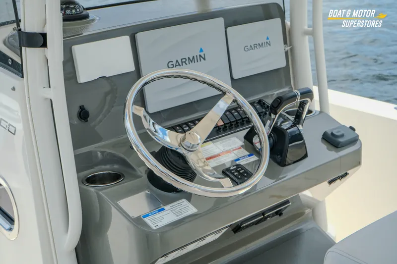 Slide: The Image of 2016 Pursuit C 260 Center Console boat dashboard with Garmin navigation system. - 11