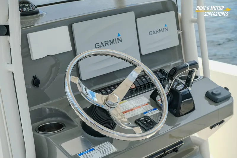 Slide: The Image of 2016 Pursuit C 260 Center Console helm with Garmin navigation displays. - 12