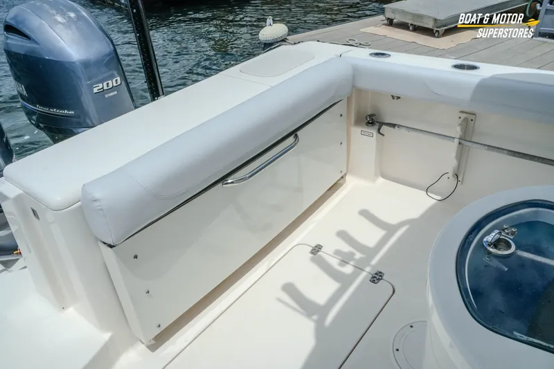 Slide: The Image of 2016 Pursuit C 260 Center Console boat interior with Yamaha 200 engine. - 18
