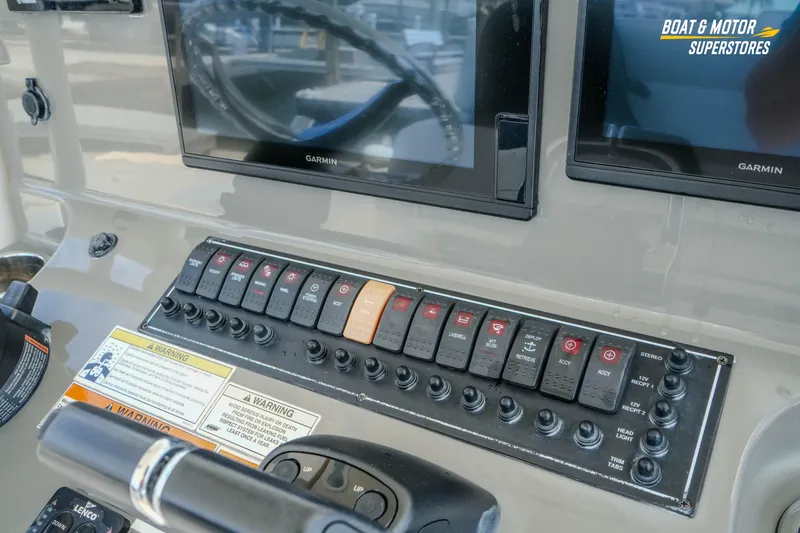 Slide: The Image of Control panel of a 2016 Pursuit C 260 Center Console boat with Garmin displays. - 21