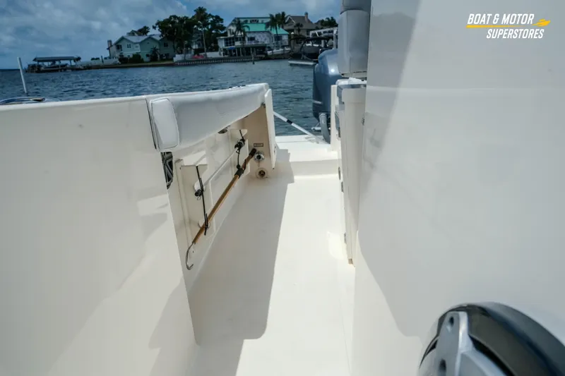 Slide: The Image of 2016 Pursuit C 260 Center Console boat interior with waterfront view. - 26