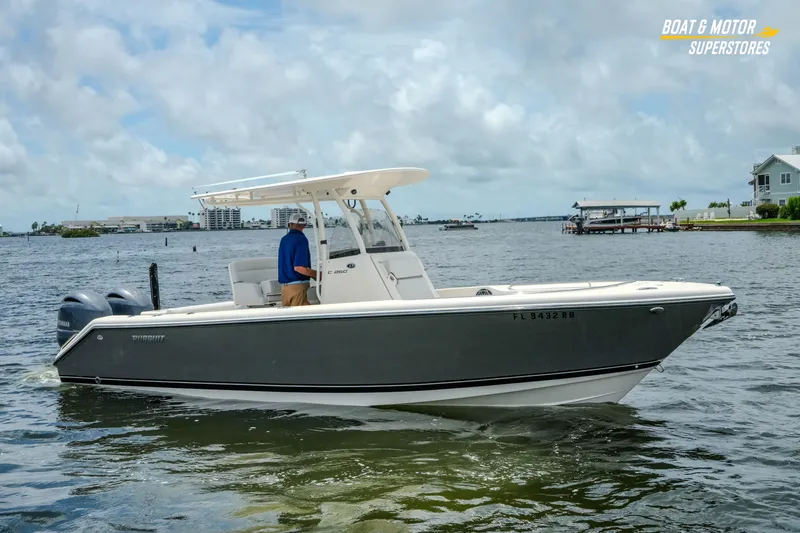 Slide: The Image of 2016 Pursuit C 260 Center Console boat on water, clear sky background. - 29