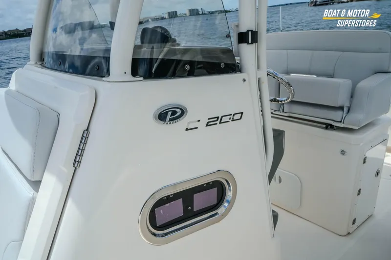Slide: The Image of 2016 Pursuit C 260 Center Console boat interior with seating and console details. - 3