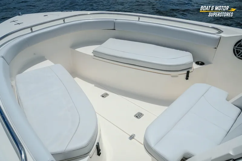 Slide: The Image of 2016 Pursuit C 260 Center Console boat interior with cushioned seating. - 5