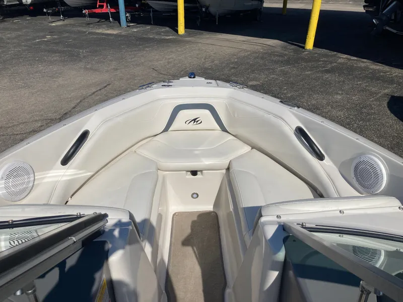 Slide: The Image of Interior view of a 2012 Monterey 204FS boat with white seating. - 16