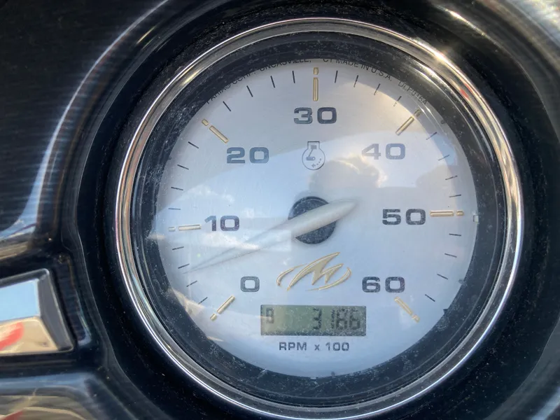 Slide: The Image of Tachometer of a 2012 Monterey 204FS boat, displaying 318 hours. - 17