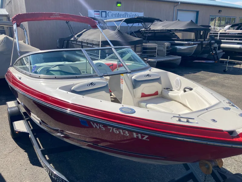 Slide: The Image of 2012 Monterey 204FS boat, red and white, on trailer. - 5