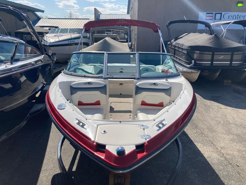 Slide: The Image of 2012 Monterey 204FS boat parked in a marina. - 6