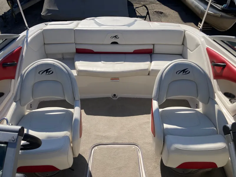 Slide: The Image of Interior of a 2012 Monterey 204FS boat with white seating. - 8