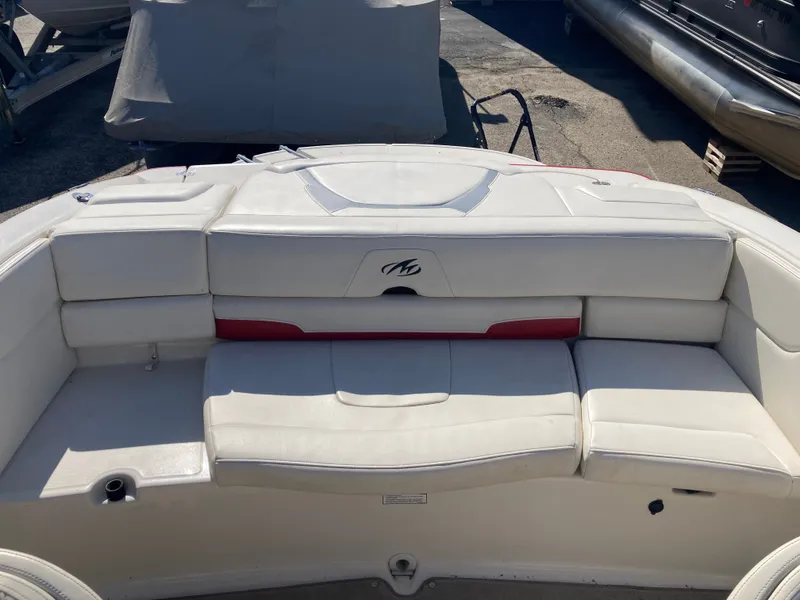 Slide: The Image of Rear view of a 2012 Monterey 204FS boat with white upholstery. - 9
