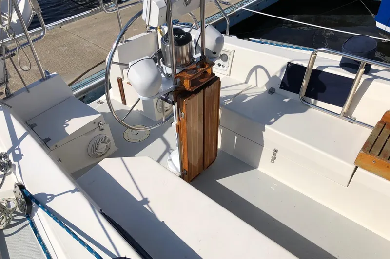 Slide: The Image of Cockpit of a 1992 Catalina 34 sailboat with steering wheel and seating. - 15