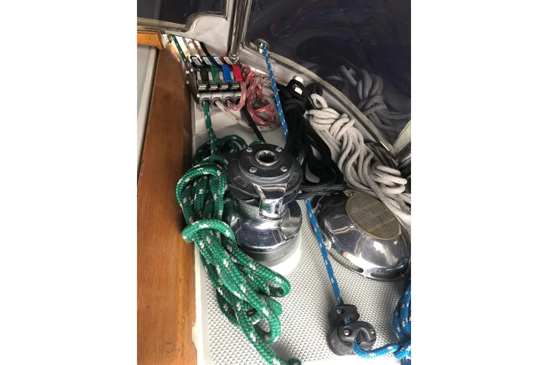 Slide: The Image of Sailing equipment on a 1992 Catalina 34, featuring ropes and winches. - 17