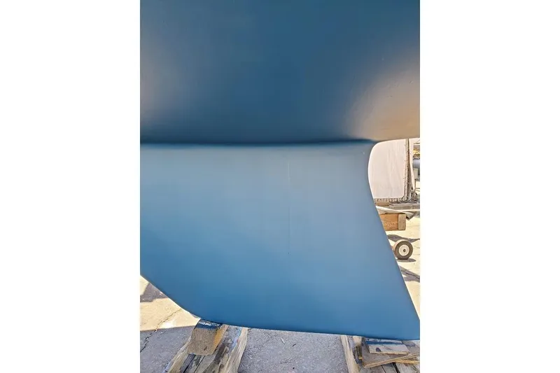 Slide: The Image of Close-up of a 1992 Catalina 34 sailboat keel in a boatyard. - 21