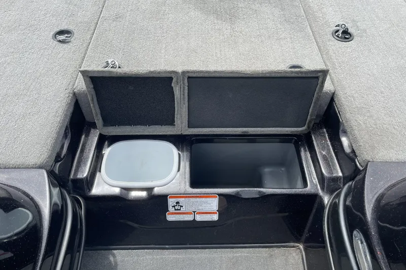 Slide: The Image of 2013 Nitro Z-8 boat storage compartments with open lids, showcasing interior space. - 10