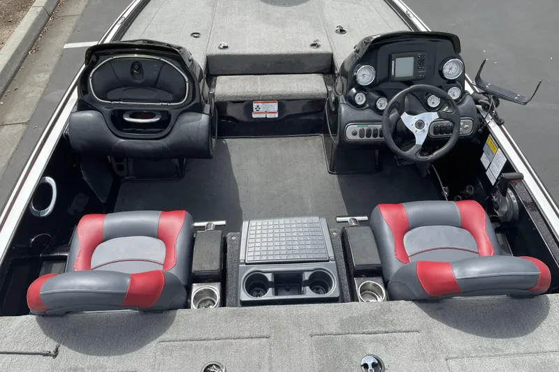 Slide: The Image of Interior of a 2013 Nitro Z-8 boat with red and gray seating. - 12