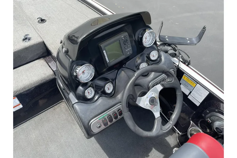 Slide: The Image of Steering console of a 2013 Nitro Z-8 boat with gauges and navigation system. - 14