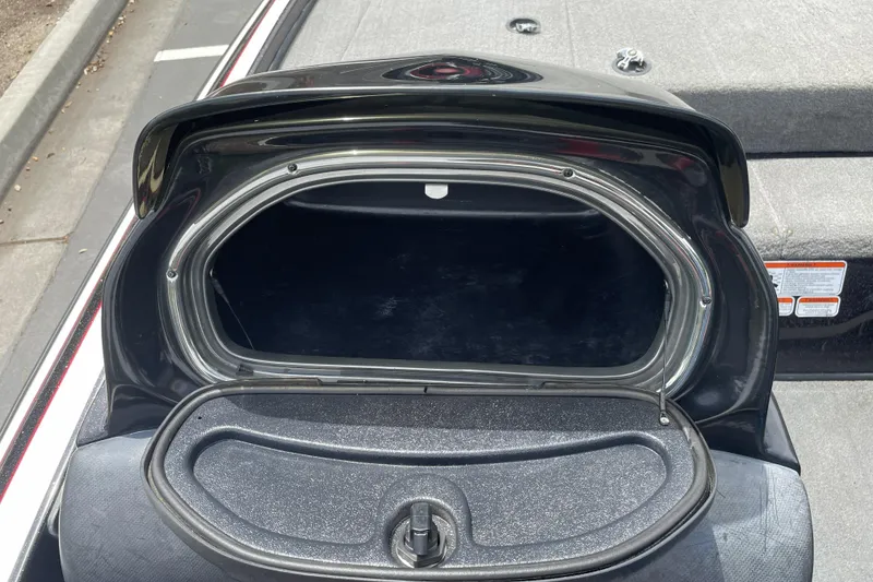 Slide: The Image of Open storage compartment of a 2013 Nitro Z-8 boat, showcasing interior space. - 16