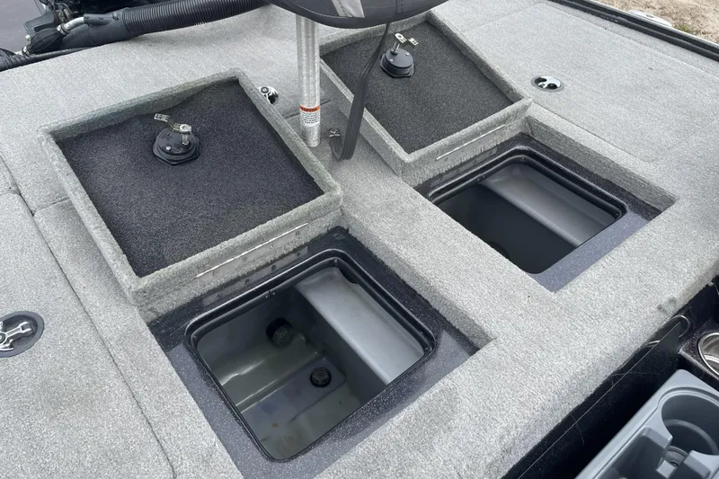 Slide: The Image of 2013 Nitro Z-8 boat storage compartments with open lids, showcasing interior space. - 19
