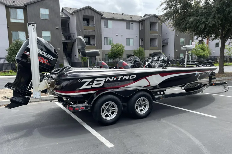 Slide: The Image of 2013 Nitro Z-8 boat with Mercury engine parked in residential area. - 2