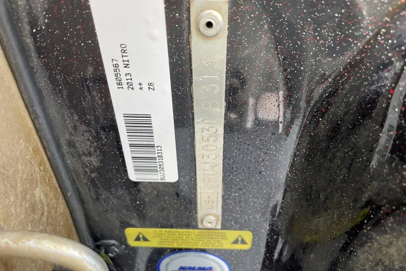 Slide: The Image of Close-up of a 2013 Nitro Z-8 model identification plate with barcode and serial number. - 23