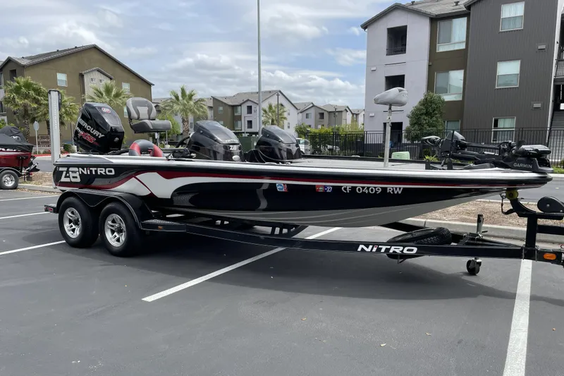 Slide: The Image of 2013 Nitro Z-8 boat with trailer parked in residential area. - 3