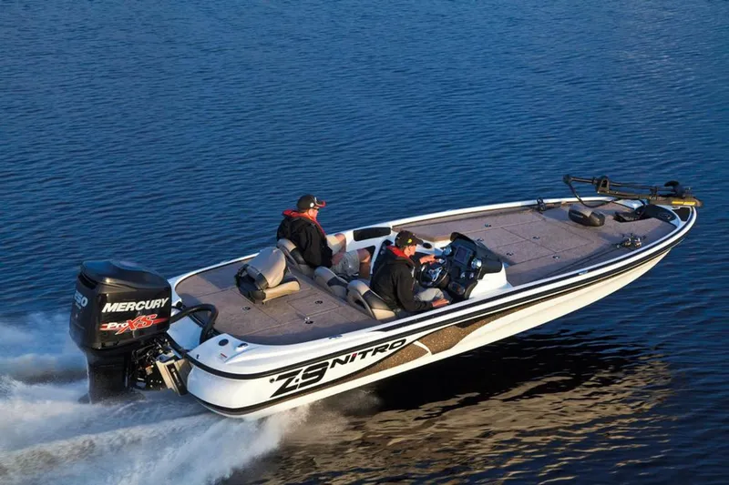 Slide: The Image of Manufacturer Provided Image: 2013 Nitro Z-8 boat cruising on water with two passengers. - 34