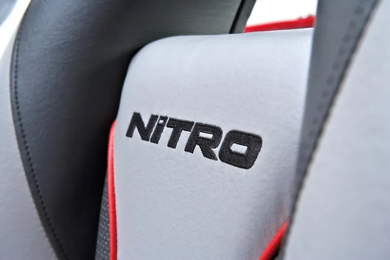 Slide: The Image of Manufacturer Provided Image: Close-up of 2013 Nitro Z-8 seat with embroidered logo and red accents. - 38