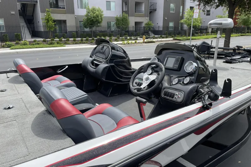 Slide: The Image of Interior of a 2013 Nitro Z-8 boat with modern dashboard and seating. - 4