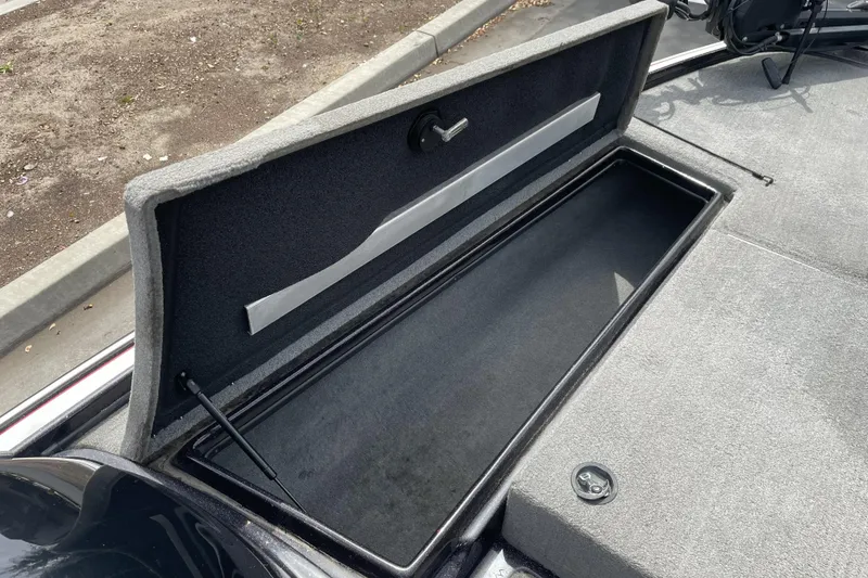 Slide: The Image of Open storage compartment in a 2013 Nitro Z-8 boat, showcasing spacious interior. - 6