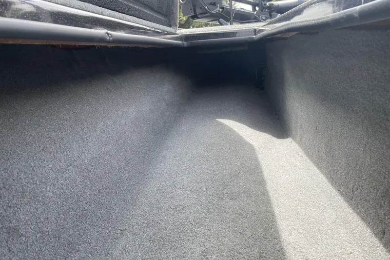 Slide: The Image of Interior view of a 2013 Nitro Z-8 boat storage compartment, carpeted and spacious. - 7